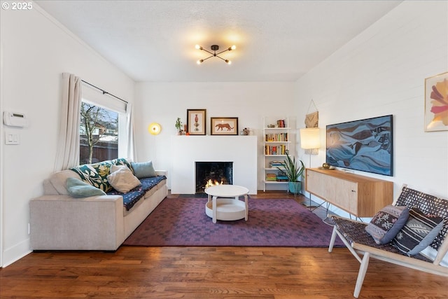 living room featuring dark hardwood / wood-style flooring and a textured ceiling