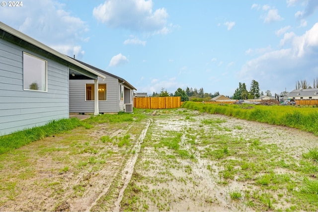 view of yard featuring central air condition unit