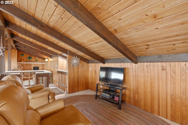 living room featuring a wealth of natural light, wooden walls, a water view, and wood ceiling