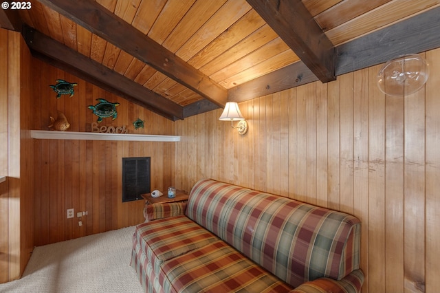 carpeted bedroom featuring beam ceiling, wooden ceiling, visible vents, and wooden walls