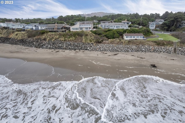 property view of water with a mountain view and a residential view