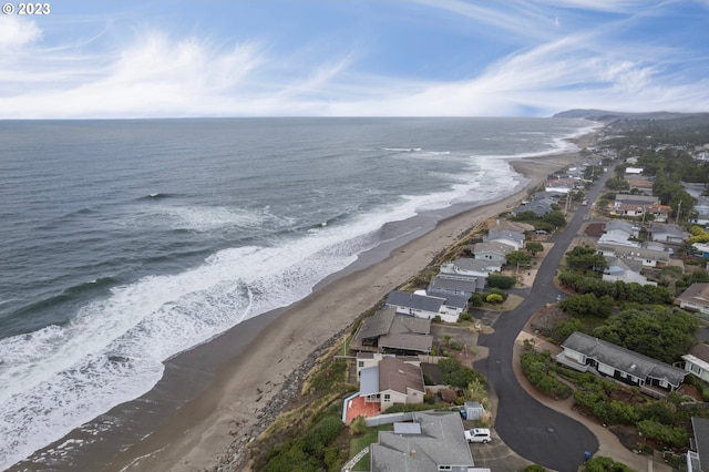 aerial view featuring a water view and a view of the beach