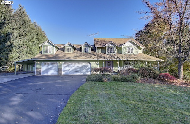 view of front facade with driveway, stone siding, a garage, and a front lawn