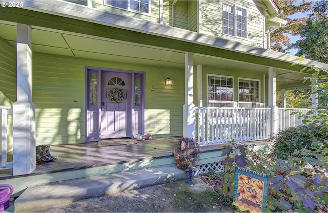 property entrance with covered porch