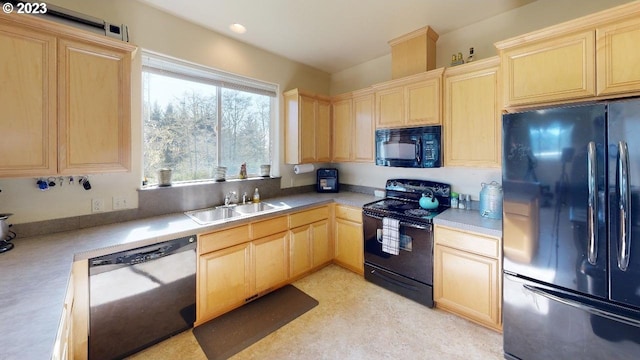 kitchen featuring light brown cabinetry, black appliances, and sink