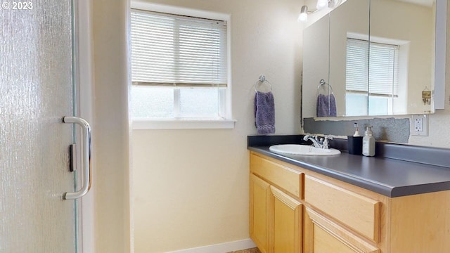 bathroom featuring vanity and plenty of natural light