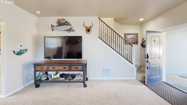 view of carpeted entrance foyer