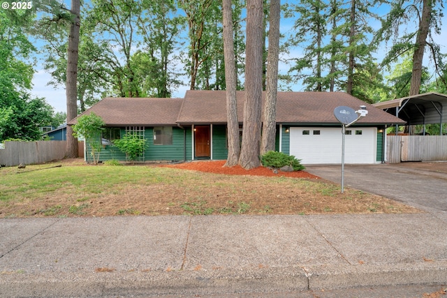 25191 Berry Ln, Veneta, OR 97487 - view of front facade with asphalt driveway, a carport, a shingled roof, and a garage