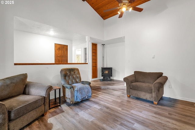 25191 Berry Ln, Veneta, OR 97487 - sitting room featuring a wood stove, a ceiling fan, wooden ceiling, wood finished floors, and high vaulted ceiling