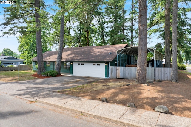 25191 Berry Ln, Veneta, OR 97487 - view of front of home featuring driveway, a garage, a detached carport, and roof with shingles