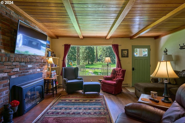 sitting room featuring hardwood / wood-style floors, beam ceiling, wooden ceiling, and a fireplace