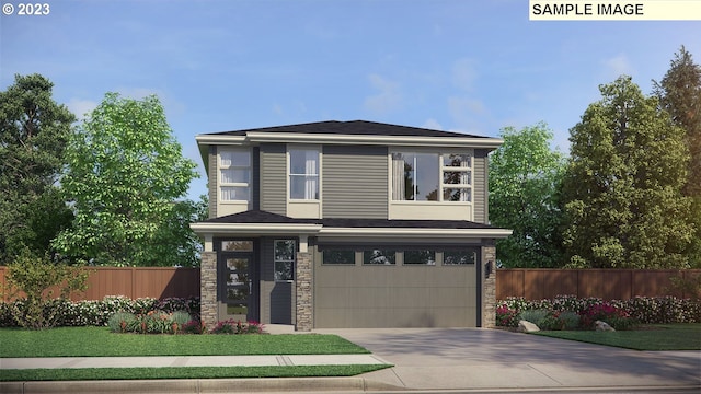 view of front of house with a front yard and a garage