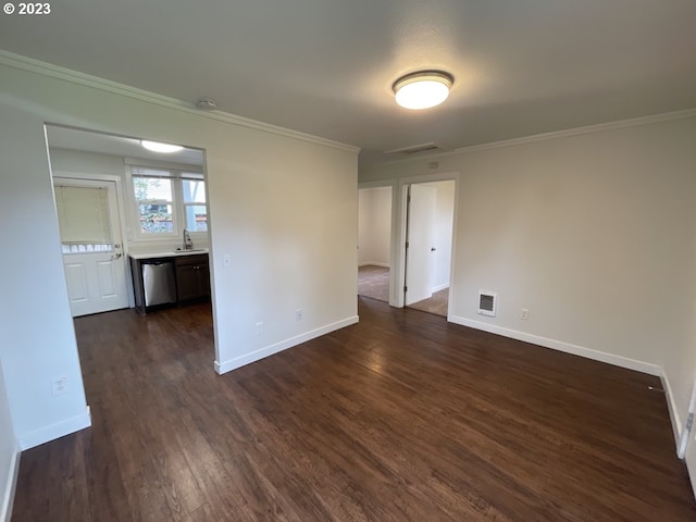 spare room featuring sink, crown molding, and dark hardwood / wood-style flooring