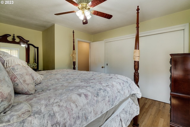 bedroom with ceiling fan and wood-type flooring