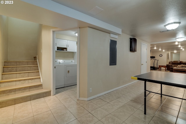 basement with independent washer and dryer and light tile flooring