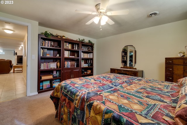 bedroom featuring ceiling fan and light tile floors