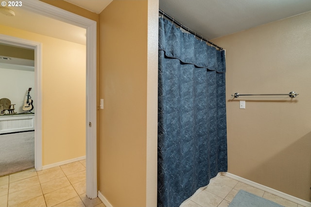 bathroom with tile flooring