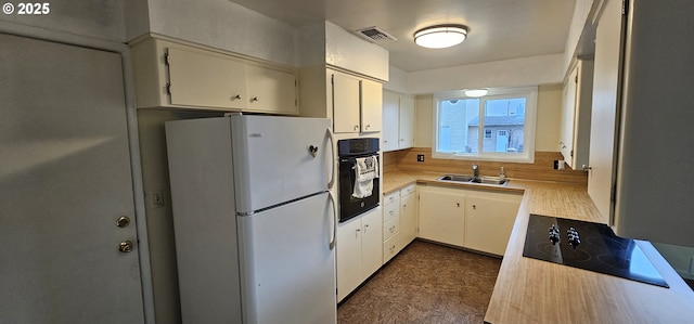 29545 Bailor St, Gold Beach, OR 97444 - kitchen with black appliances, light countertops, and a sink