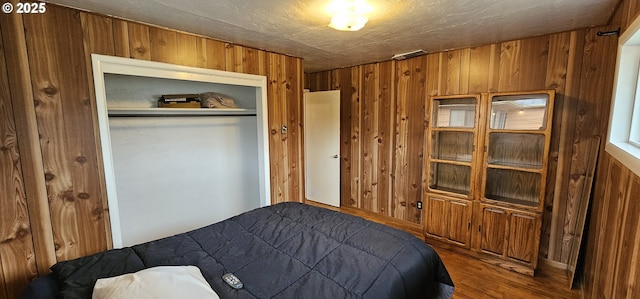 29545 Bailor St, Gold Beach, OR 97444 - bedroom featuring wooden walls, wood finished floors, and a closet