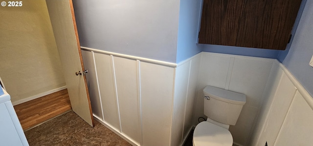 29545 Bailor St, Gold Beach, OR 97444 - bathroom with a wainscoted wall, toilet, a decorative wall, and wood finished floors