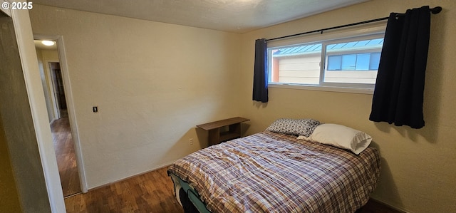 bedroom featuring wood finished floors