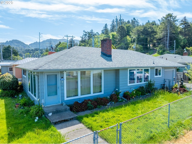 29545 Bailor St, Gold Beach, OR 97444 - view of front of home featuring a chimney, a mountain view, and a shingled roof