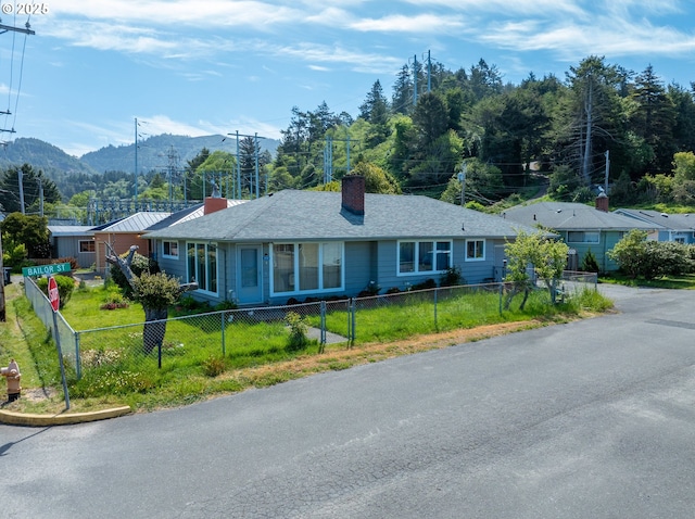 29545 Bailor St, Gold Beach, OR 97444 - single story home with a chimney and a mountain view
