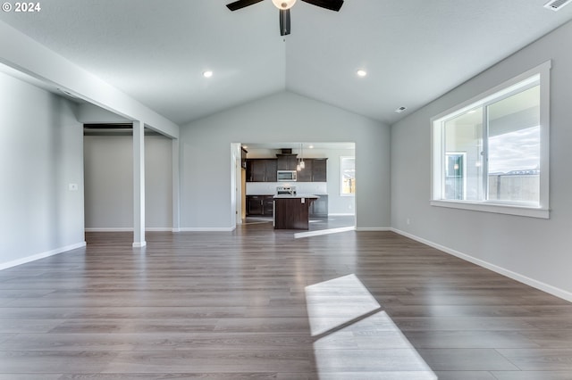 unfurnished living room featuring lofted ceiling, hardwood / wood-style floors, and ceiling fan