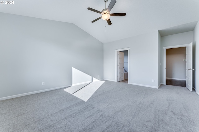 unfurnished bedroom with ensuite bath, lofted ceiling, light carpet, and ceiling fan