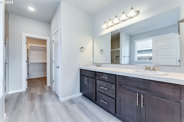 bathroom with vanity and hardwood / wood-style floors