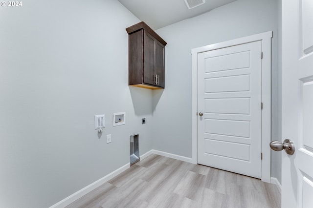 laundry room featuring light hardwood / wood-style floors, hookup for an electric dryer, hookup for a washing machine, and cabinets