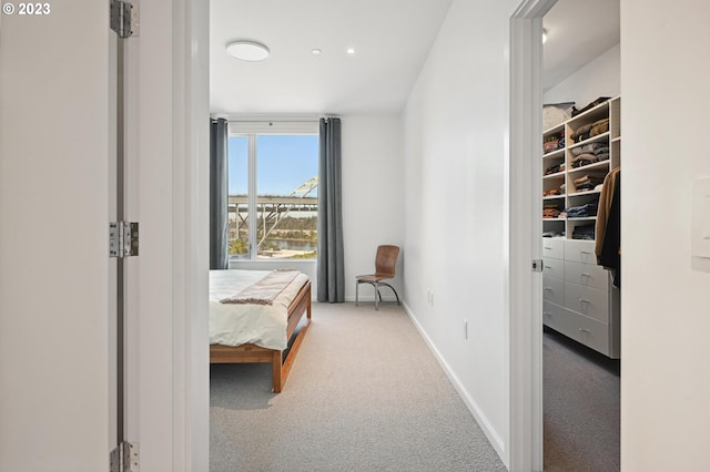 bedroom featuring light colored carpet