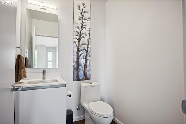 bathroom with toilet and vanity