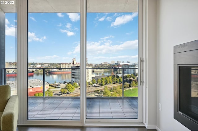 doorway to outside with a water view