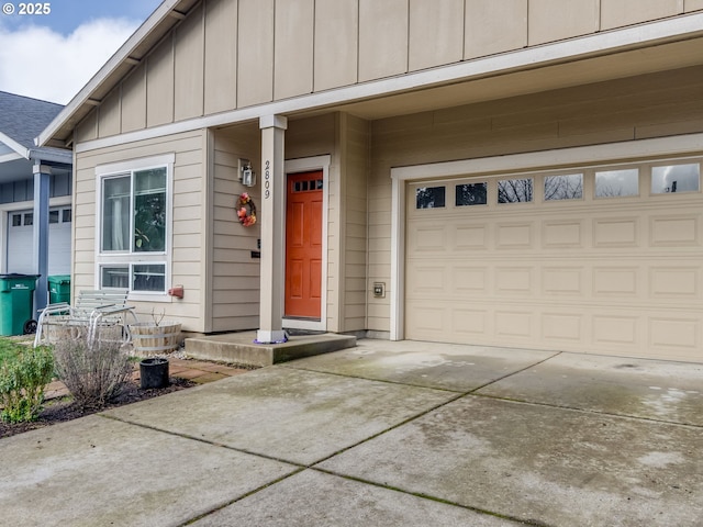 exterior space featuring board and batten siding, driveway, and a garage