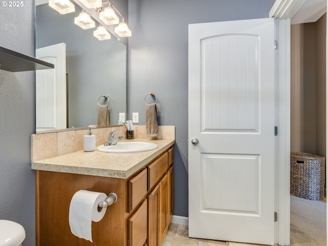 bathroom with tile patterned flooring and vanity