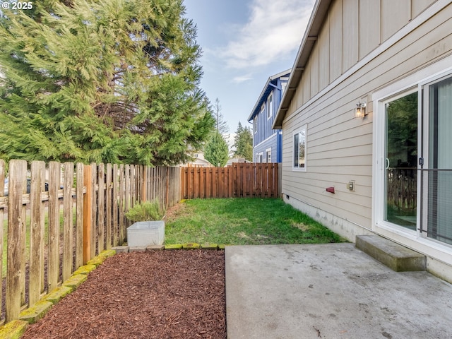 view of yard featuring a patio area and a fenced backyard