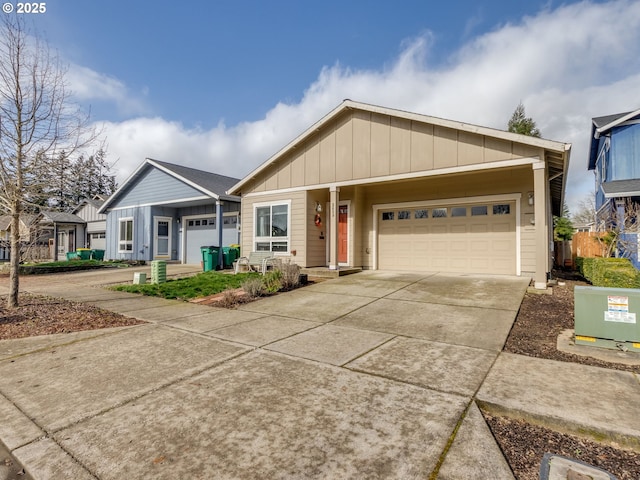 ranch-style home featuring board and batten siding, concrete driveway, and an attached garage