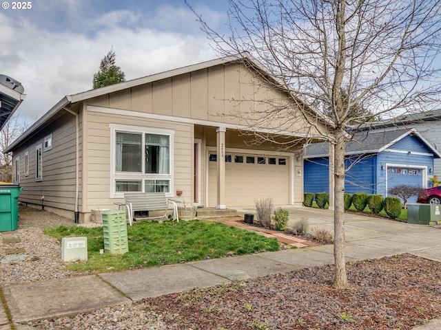 view of front of property with a garage and concrete driveway