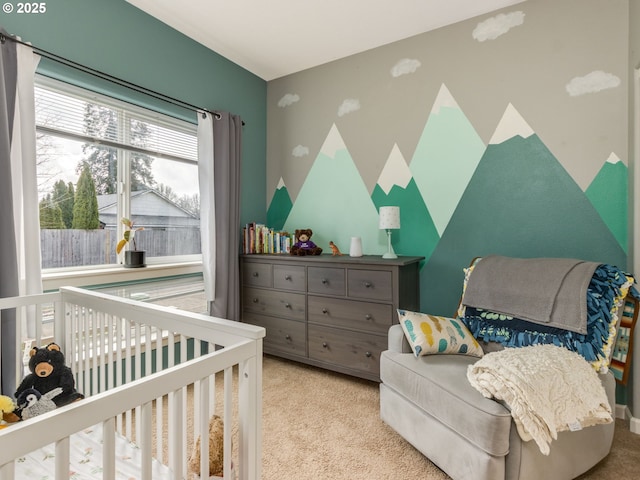 bedroom with light colored carpet and a crib