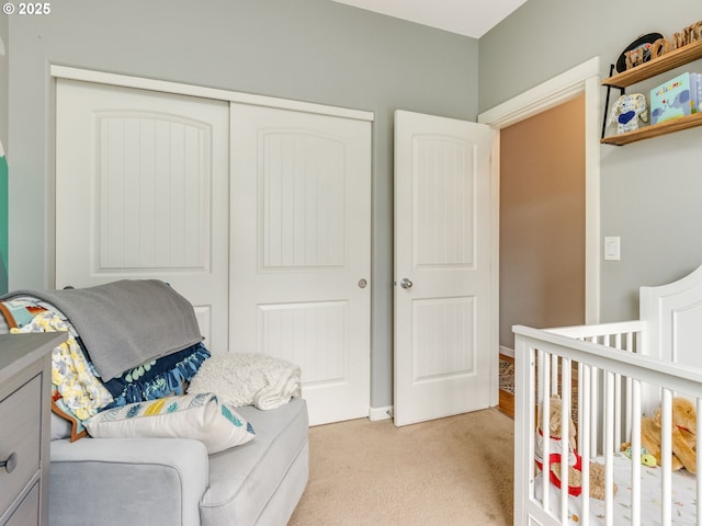 bedroom with light carpet and a closet