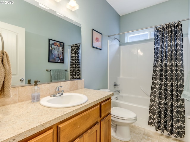 bathroom with toilet, tile patterned flooring, shower / bath combo with shower curtain, and vanity