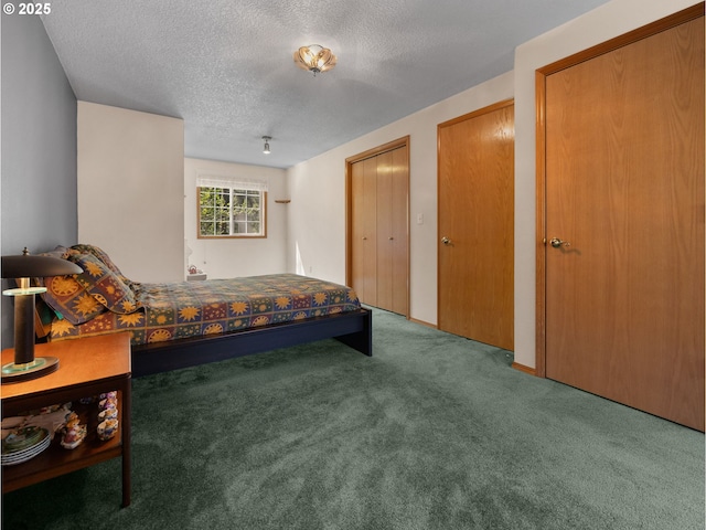 65679 E Alpine Way, Rhododendron, OR 97049 - bedroom featuring a textured ceiling, multiple closets, and carpet