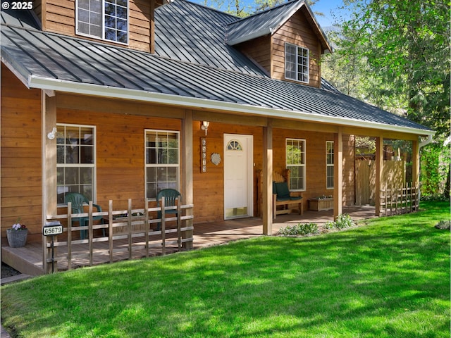 65679 E Alpine Way, Rhododendron, OR 97049 - entrance to property featuring covered porch, a lawn, a standing seam roof, and metal roof