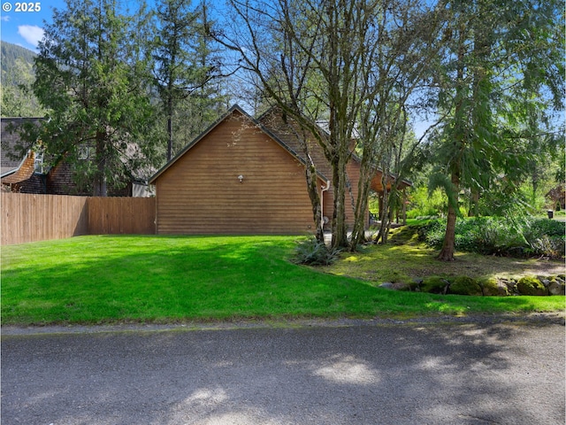 65679 E Alpine Way, Rhododendron, OR 97049 - view of side of property with fence and a yard