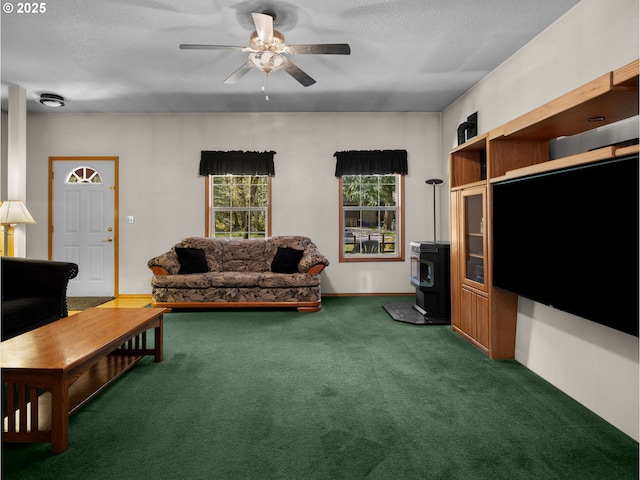 65679 E Alpine Way, Rhododendron, OR 97049 - carpeted living room with a wood stove, a ceiling fan, and a textured ceiling