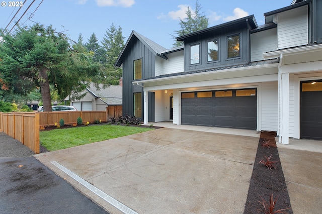 view of front facade featuring a front yard and a garage