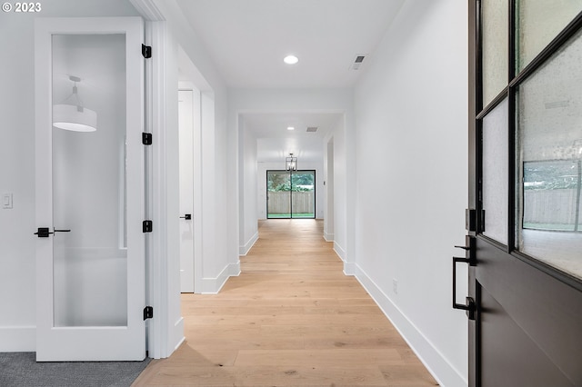 hallway featuring light hardwood / wood-style flooring