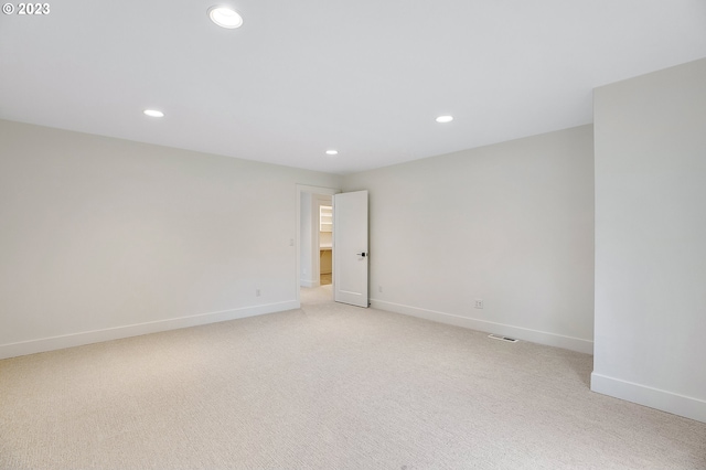 empty room with light colored carpet