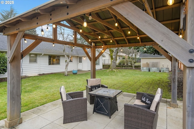 view of patio featuring a gazebo and a fire pit